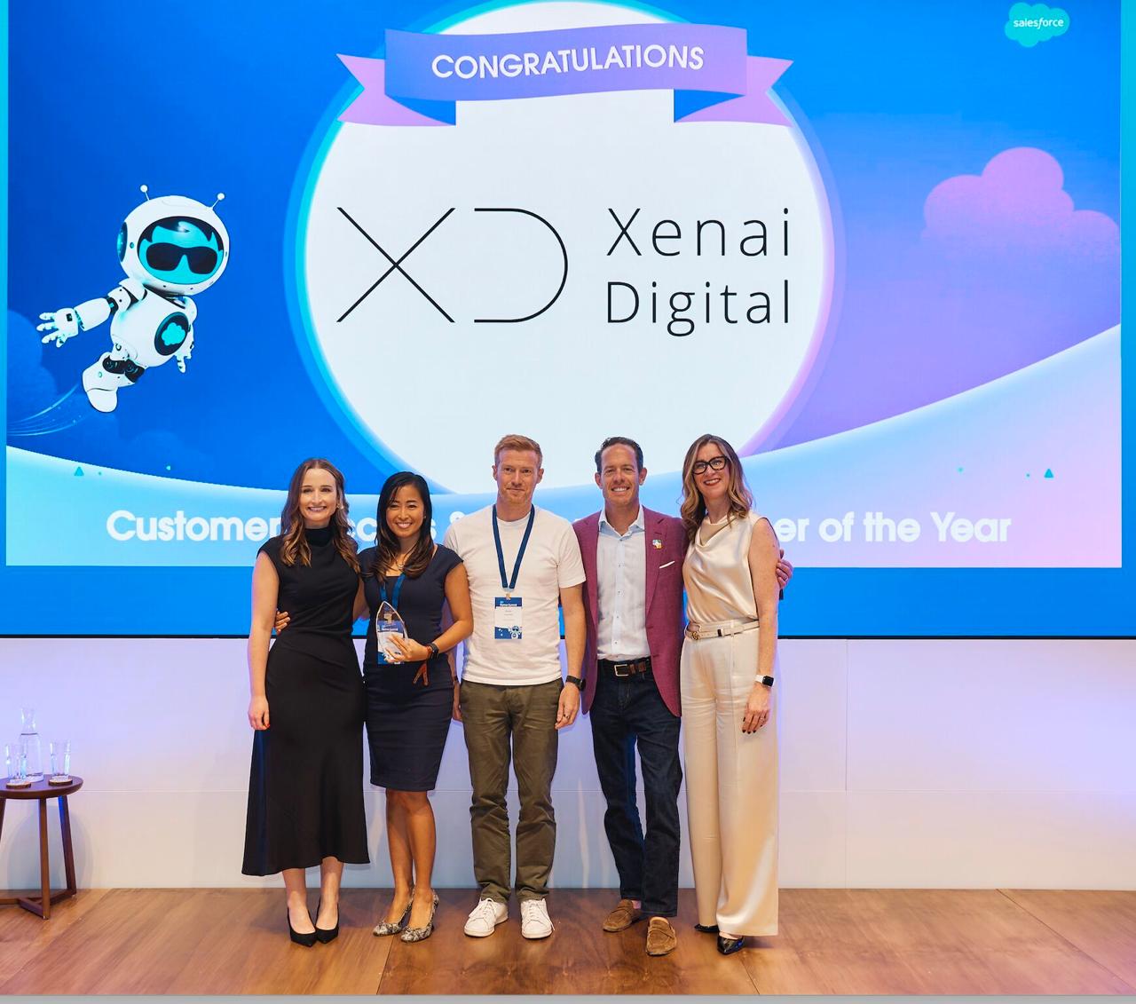 Xenai Digital team receiving Salesforce Partner of the Year award